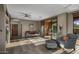 Comfortable living room featuring a ceiling fan and sliding glass doors leading to outdoor patio at 7199 E Ridgeview Pl # 221, Carefree, AZ 85377