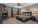 Comfortable main bedroom featuring a fireplace and large picture window with an amazing mountain view at 7199 E Ridgeview Pl # 221, Carefree, AZ 85377