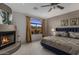 Bedroom with fireplace and large picture window with amazing mountain views at 7199 E Ridgeview Pl # 221, Carefree, AZ 85377