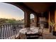 Outdoor dining space featuring a wrought iron railing and a grill at 7199 E Ridgeview Pl # 221, Carefree, AZ 85377