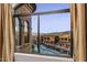 Beautiful view of community pool and surrounding buildings from bedroom window at 7199 E Ridgeview Pl # 221, Carefree, AZ 85377