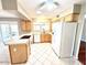Spacious kitchen with ample countertop space, white appliances, and bright natural lighting at 814 S 80Th St, Mesa, AZ 85208