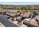 Scenic aerial view of desert home showcasing its pool, rooftop patio and lush desert surroundings at 8879 E Greenview Dr, Gold Canyon, AZ 85118