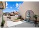 Tranquil courtyard with a fountain, desert landscaping, and tiled wall art at 8879 E Greenview Dr, Gold Canyon, AZ 85118