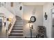 Grand entryway showcasing a curved staircase and designer decor at 8879 E Greenview Dr, Gold Canyon, AZ 85118