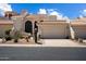 Exterior of home with desert landscaping, garage doors and unique architecture at 8879 E Greenview Dr, Gold Canyon, AZ 85118