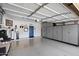 Clean garage with gray cabinets, well lit with a painted floor at 8879 E Greenview Dr, Gold Canyon, AZ 85118