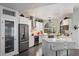 Modern kitchen with stainless steel appliances, granite countertops, and an island with seating at 8879 E Greenview Dr, Gold Canyon, AZ 85118