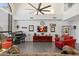 A grand room featuring high ceilings, large windows, tile floors, and comfortable seating at 8879 E Greenview Dr, Gold Canyon, AZ 85118