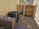 Enclosed backyard area with gravel, stone pavers, and a wood and metal gate at 9137 W Coolbrook Ave, Peoria, AZ 85382