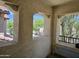 Inviting balcony with three unique view portals and a comfortable bench for enjoying the scenery at 9137 W Coolbrook Ave, Peoria, AZ 85382