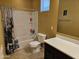 Bathroom featuring a toilet, tub with shower, and a vanity at 9137 W Coolbrook Ave, Peoria, AZ 85382