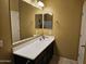 Bathroom vanity with large mirror and modern fixtures at 9137 W Coolbrook Ave, Peoria, AZ 85382