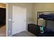 Well-lit bedroom with bunkbeds, a storage chest, and sliding closet doors at 9137 W Coolbrook Ave, Peoria, AZ 85382