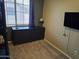 Bedroom featuring dresser, carpet, and window at 9137 W Coolbrook Ave, Peoria, AZ 85382