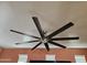 Living room ceiling fan with multiple blades and overhead lighting at 9137 W Coolbrook Ave, Peoria, AZ 85382