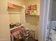 Bedroom closet with double hanging rods and boxes offers storage at 9137 W Coolbrook Ave, Peoria, AZ 85382