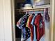 Organized closet with clothing and storage shelf at 9137 W Coolbrook Ave, Peoria, AZ 85382