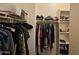 Spacious walk-in closet with ample storage solutions, hanging rods, and shelving for clothes and accessories at 9137 W Coolbrook Ave, Peoria, AZ 85382