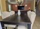 Bright dining room showcasing a large table with stylish chairs, flowing into the living area at 9137 W Coolbrook Ave, Peoria, AZ 85382