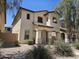 Welcoming two-story home boasts desert landscaping and a charming facade, creating an inviting curb appeal for potential buyers at 9137 W Coolbrook Ave, Peoria, AZ 85382