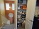 Hallway closet with storage shelves and various household items at 9137 W Coolbrook Ave, Peoria, AZ 85382