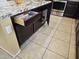 Close-up of kitchen island with granite countertop, ample storage, and electrical outlets at 9137 W Coolbrook Ave, Peoria, AZ 85382