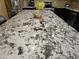 A close up of the granite countertop on the large kitchen island at 9137 W Coolbrook Ave, Peoria, AZ 85382