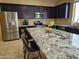 A close-up of the granite countertops on the large kitchen island at 9137 W Coolbrook Ave, Peoria, AZ 85382