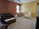 A combined living room and Bedroom featuring plush sofas, a rocking chair, and neutral carpeting at 9137 W Coolbrook Ave, Peoria, AZ 85382