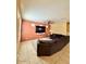Inviting living room featuring a plush sectional sofa, TV, and natural light at 9137 W Coolbrook Ave, Peoria, AZ 85382
