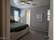 Comfortable bedroom featuring a queen bed and neutral decor at 9137 W Coolbrook Ave, Peoria, AZ 85382