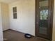 Relaxing outdoor patio with a sliding door, window, and neutral flooring at 9137 W Coolbrook Ave, Peoria, AZ 85382