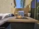 Inviting outdoor patio featuring a fire pit, grill, and comfortable seating, perfect for relaxing and entertaining at 9137 W Coolbrook Ave, Peoria, AZ 85382