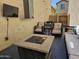 Relaxing outdoor patio with fire pit, seating and dining area for casual gatherings and outdoor enjoyment at 9137 W Coolbrook Ave, Peoria, AZ 85382