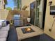 Cozy outdoor patio with grill, fire pit and seating for relaxed entertaining at 9137 W Coolbrook Ave, Peoria, AZ 85382