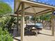 A well-equipped poolside cabana featuring a picnic table with a view of the community pool at 9137 W Coolbrook Ave, Peoria, AZ 85382