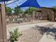 Inviting community pool area with sun loungers, shade umbrellas, and meticulous landscaping at 9137 W Coolbrook Ave, Peoria, AZ 85382
