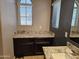 Bathroom vanity with countertop and ample storage at 9137 W Coolbrook Ave, Peoria, AZ 85382