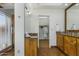 Bright bathroom with wood cabinets, granite countertops, tiled floors, and glass shower with door at 9154 E Sunflower Ct, Scottsdale, AZ 85266