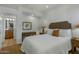 Bedroom with a queen bed, side tables and lamps. There is also a view to the bathroom and carpeted floors at 9154 E Sunflower Ct, Scottsdale, AZ 85266