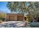 Expansive two-car garage, beautiful desert landscaping, and grand curb appeal at 9154 E Sunflower Ct, Scottsdale, AZ 85266