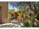 Desert home with mature landscaping, including cactus and yucca plants at 9154 E Sunflower Ct, Scottsdale, AZ 85266