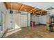 Spacious 2-car garage with Saltillo tile flooring and natural wood beam ceiling at 9154 E Sunflower Ct, Scottsdale, AZ 85266