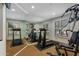 Home gym featuring wall to wall mirror, exercise equipment, and natural light at 9154 E Sunflower Ct, Scottsdale, AZ 85266
