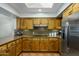 Kitchen boasts stainless steel appliances and classic wood cabinetry at 9154 E Sunflower Ct, Scottsdale, AZ 85266