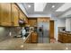 Well-appointed kitchen features stainless steel appliances and granite countertops at 9154 E Sunflower Ct, Scottsdale, AZ 85266