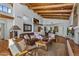 Spacious living room features wood beam ceilings and comfortable seating arrangement at 9154 E Sunflower Ct, Scottsdale, AZ 85266
