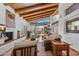 Open concept living area with fireplace, beamed ceilings, and natural light at 9154 E Sunflower Ct, Scottsdale, AZ 85266