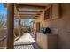 Charming patio with a built-in grill, comfortable seating, and beautiful desert surroundings at 9154 E Sunflower Ct, Scottsdale, AZ 85266
